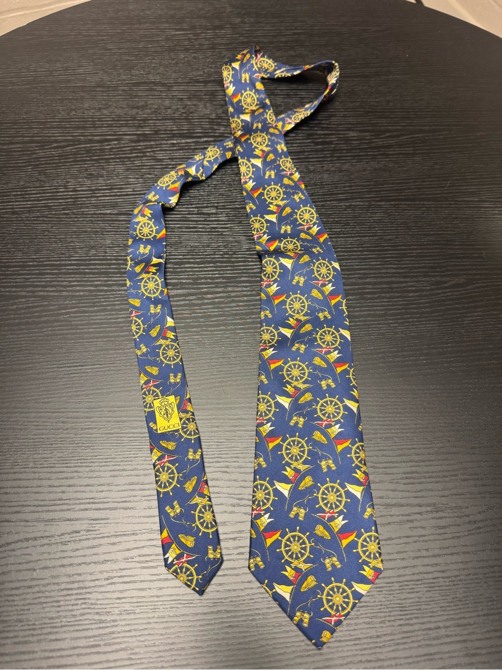 Gucci Navy Silk Tie with Yellow Nautical Wheel & Red Flag Motif